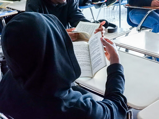Students reading a play in class.